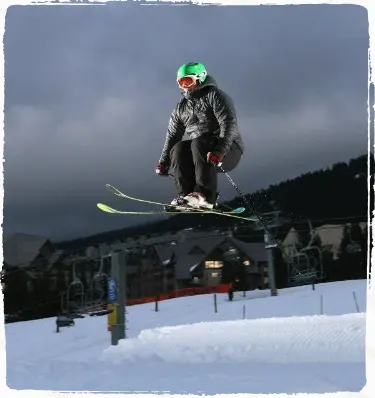 Oliver performing a jump on Skis