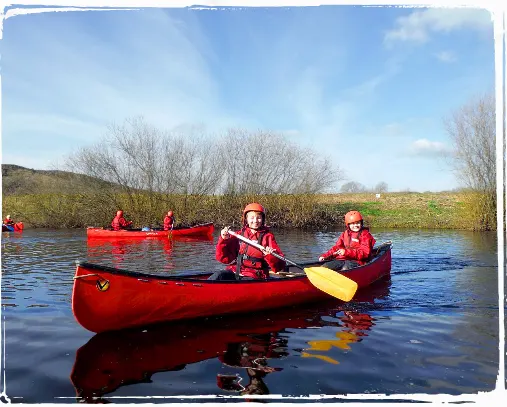 two people in canoe rowing