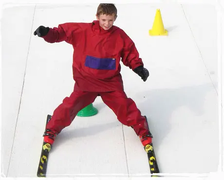 person going down a dry ski slope